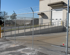 chain link fence with barbed wire